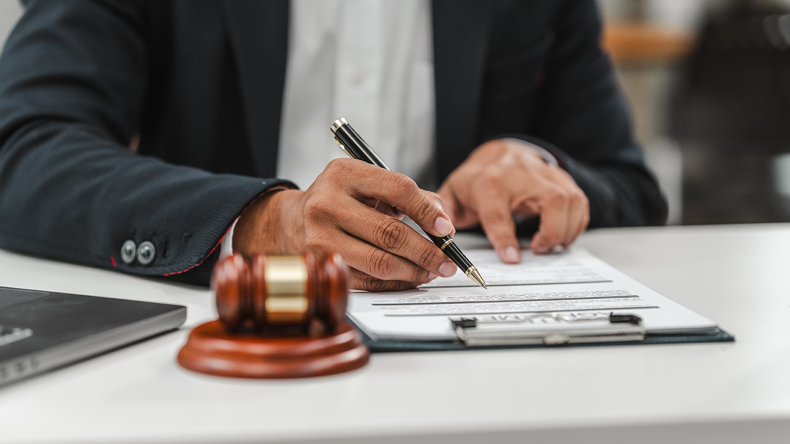 Handsome businessman lawyer of Indian descent. trusted litigation lawyers attorneys. most commonly referred to litigator, helping clients civil law services in all aspects of civil litigation cases